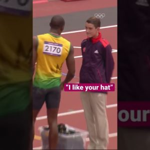 Usain Bolt gives a lucky volunteer his hat!