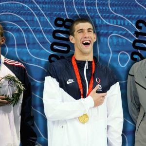 Michael Phelps wins 100m butterfly gold THREE times in a row! 🥇🥇🥇